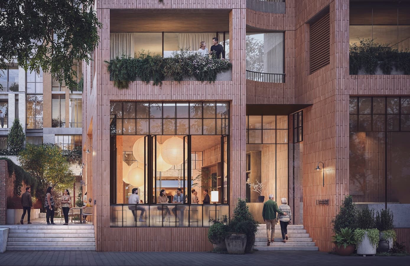 At Wynyard Street, warm evening light, active dining and planted balconies bring a softer village atmosphere to the street, while brickwork quietly references Devonport’s past.